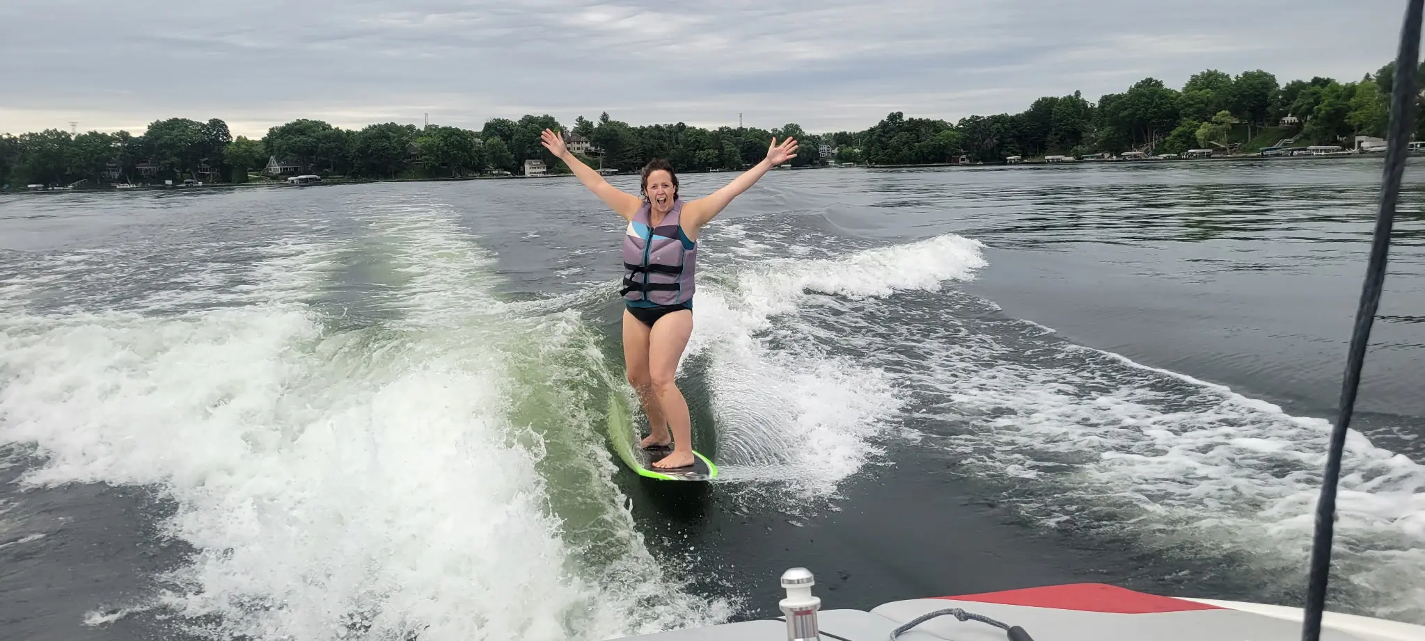 Wake surfer on open water with no nearby boats